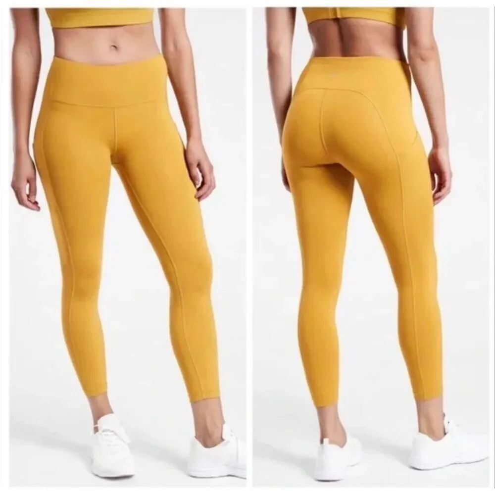 Athleta Ultimate Stash Pocket 7/8 Tight Leggings in Oxidized Yellow med